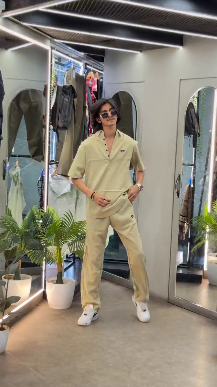 “Casual Sophistication: Grey Cuban Collar Shirt Meets Boot-Cut Trousers”