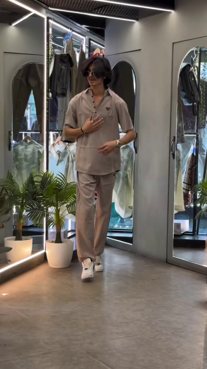 “Casual Sophistication: Grey Cuban Collar Shirt Meets Boot-Cut Trousers”