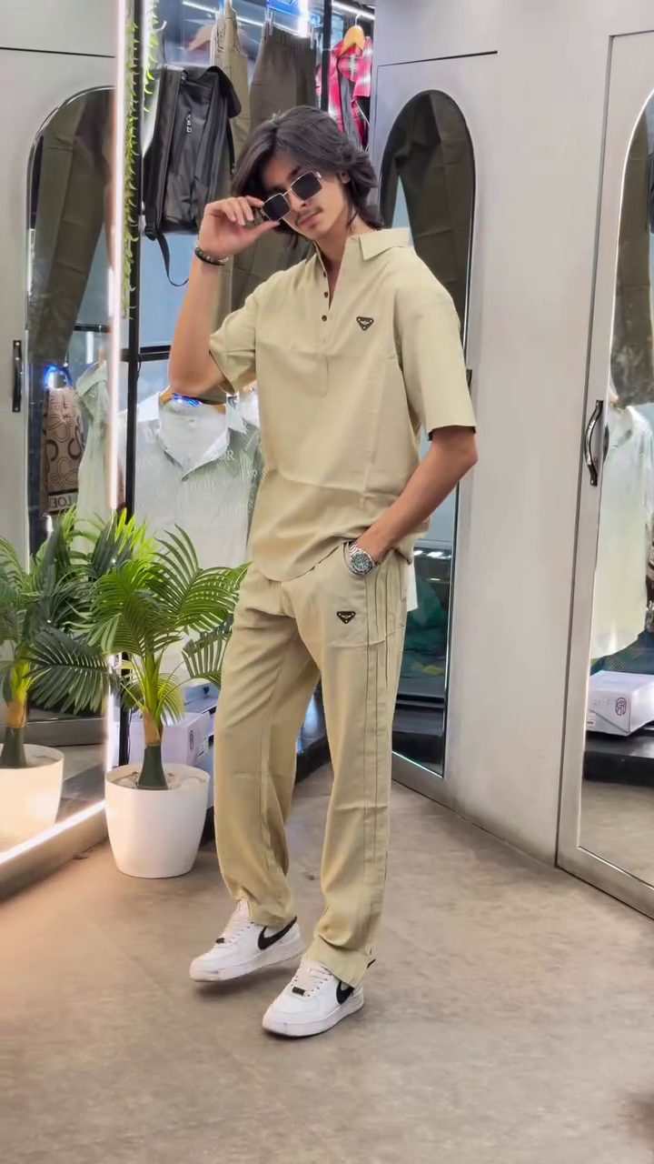 “Casual Sophistication: Grey Cuban Collar Shirt Meets Boot-Cut Trousers”