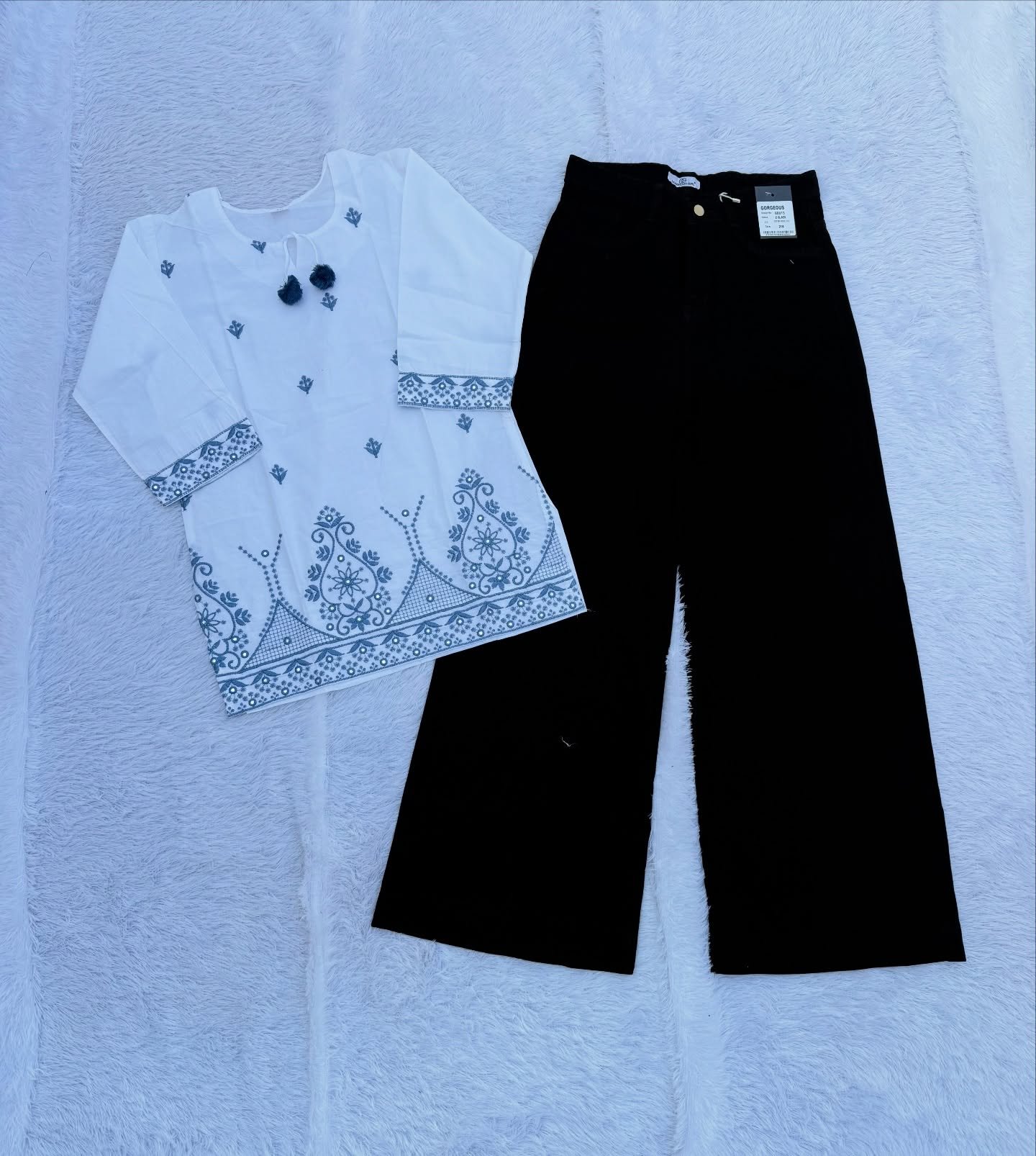 “Elegant Contrast: White Embroidered Top Meets Black Wide-Leg Palazzo Pants”
