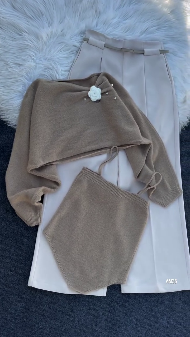 “Chic & Cozy: Knit Top Set with Floral Accent and Cream Trousers”