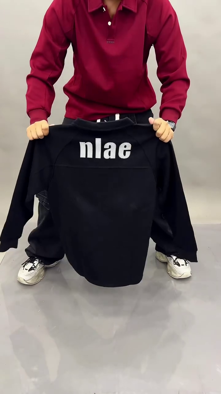 “Timeless Classic: Black Long-Sleeved Polo Shirt for Effortless Style”