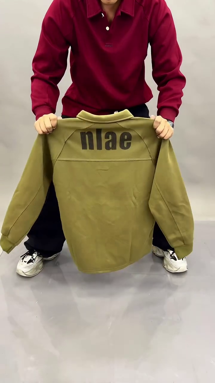 “Timeless Classic: Black Long-Sleeved Polo Shirt for Effortless Style”