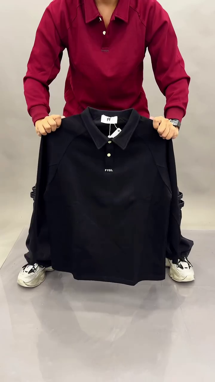 “Timeless Classic: Black Long-Sleeved Polo Shirt for Effortless Style”