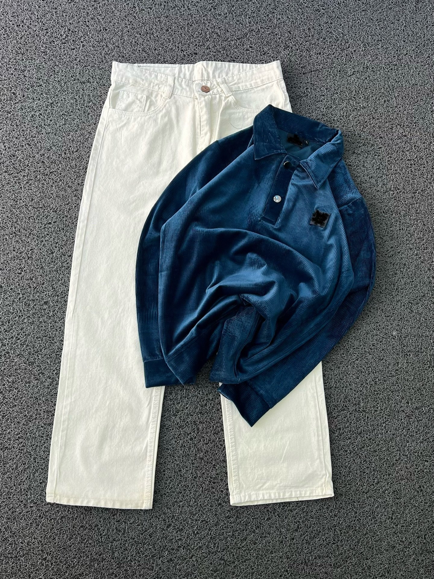 “Casual Edge Meets Classic Style: Red Corduroy Polo with Black Denim Jeans”