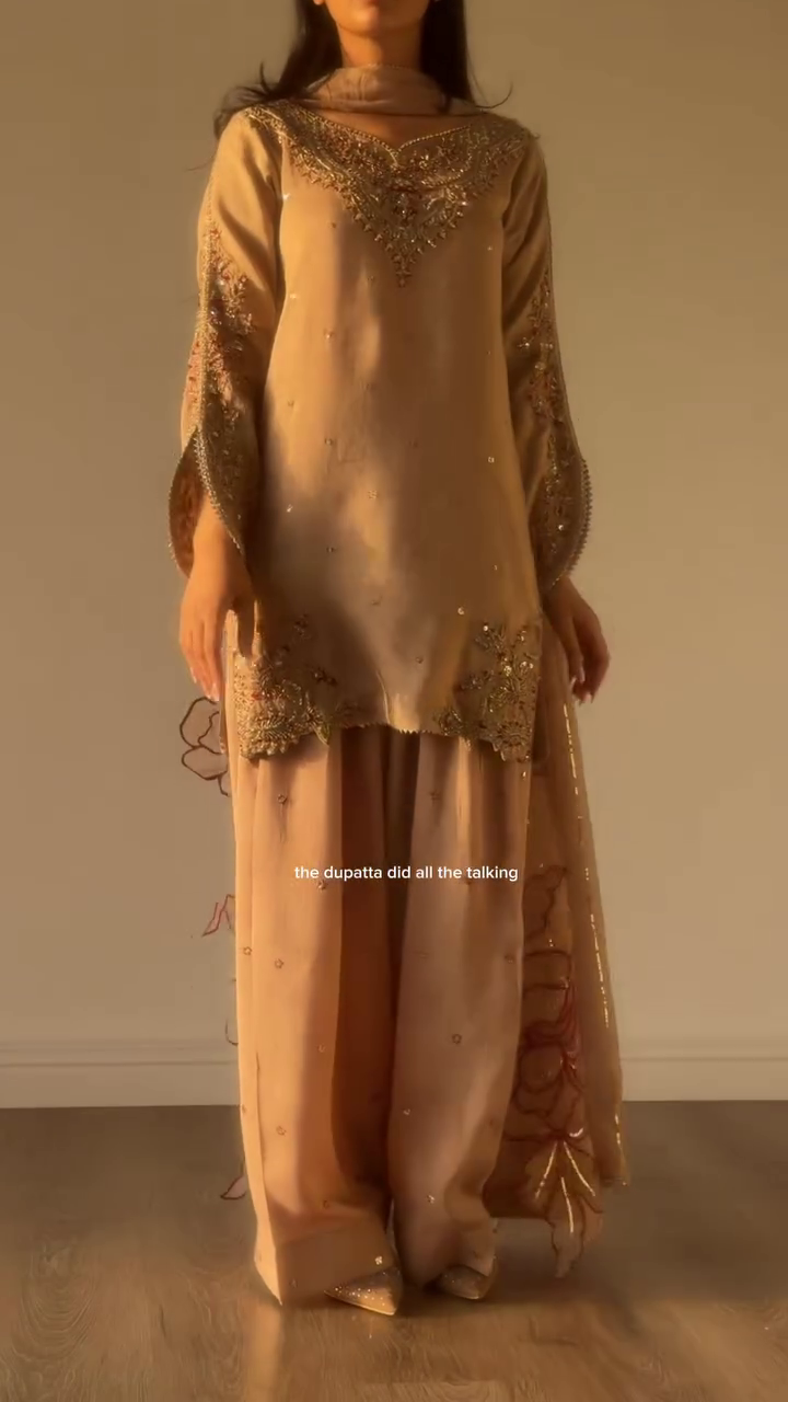 Elegant Beige Embroidered Sharara Suit Set with Heavy Lace Detailing, Statement Neckline, Embellished Sleeves & Designer Floral Dupatta