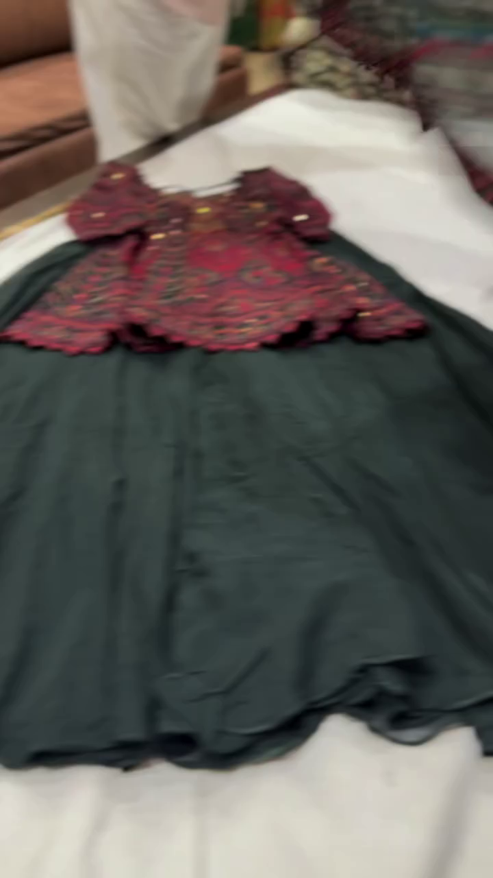 Elegant Dark Green Anarkali Dress with Rich Maroon Embroidered Bodice and Intricate Traditional Gold Detailing