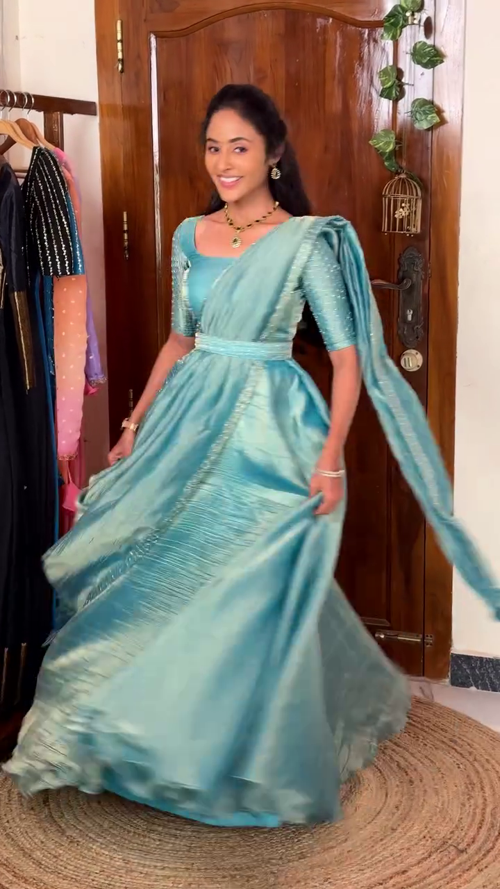 Gorgeous Silk-Style Gown Saree with Elegant Shimmer Detailing – A Royal Ethnic Look