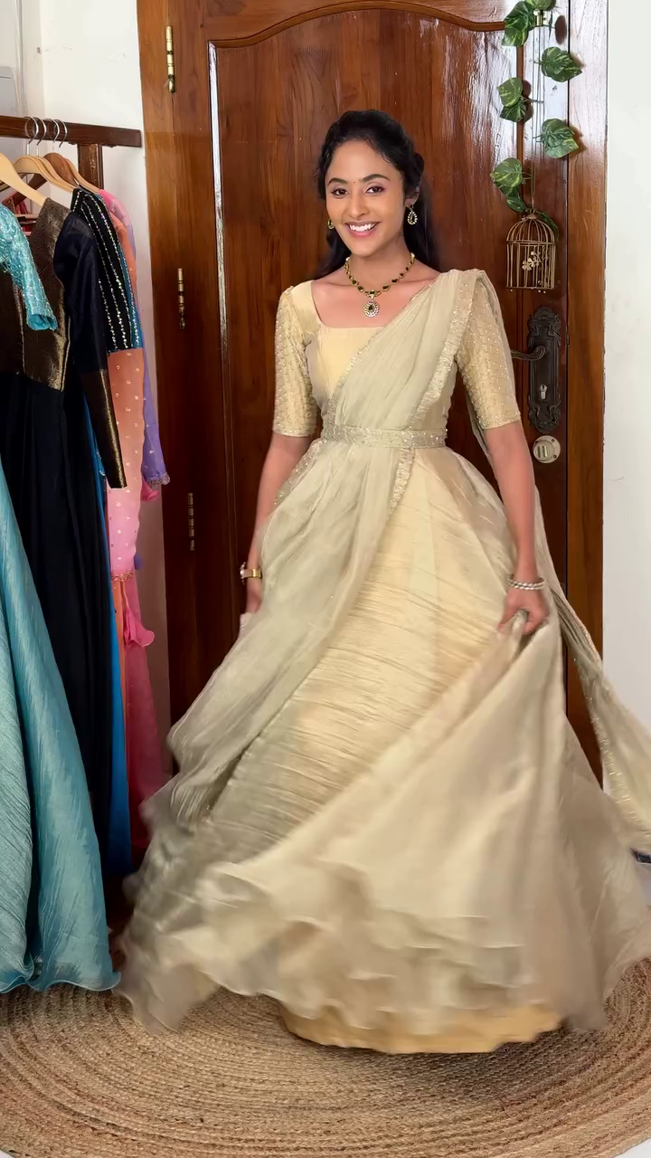 Gorgeous Silk-Style Gown Saree with Elegant Shimmer Detailing – A Royal Ethnic Look