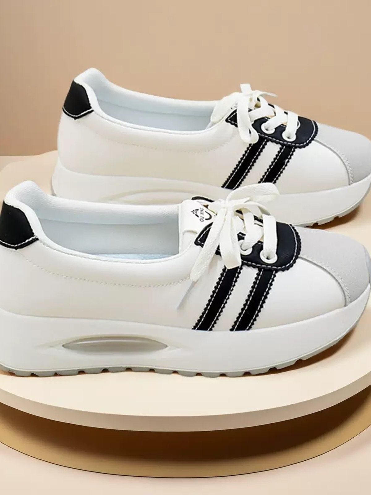 Stylish White Sneakers with Black Striped Design