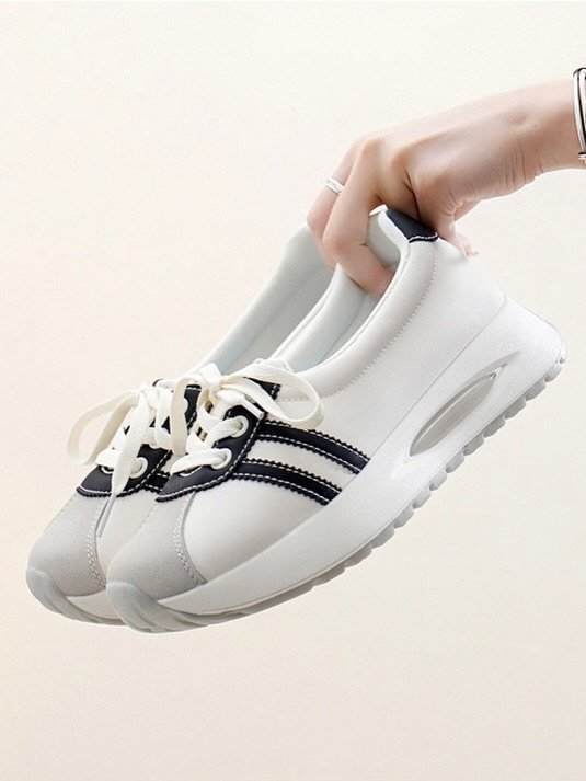 Stylish White Sneakers with Black Striped Design